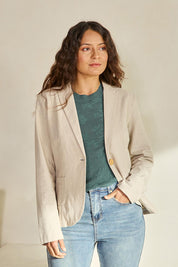 Model Tahneei wearing size 10 of the Cotton Linen Blazer - Sand in colour Sand, in a cropped view