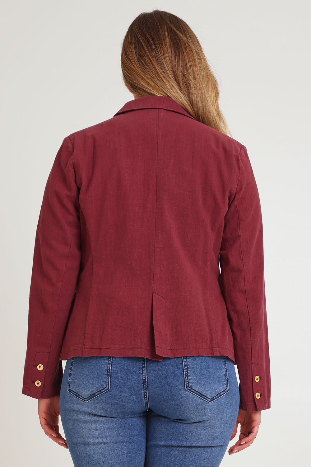 Model Chanel wearing size 16 of the Cotton Linen Blazer in colour Wine (Red), from the back