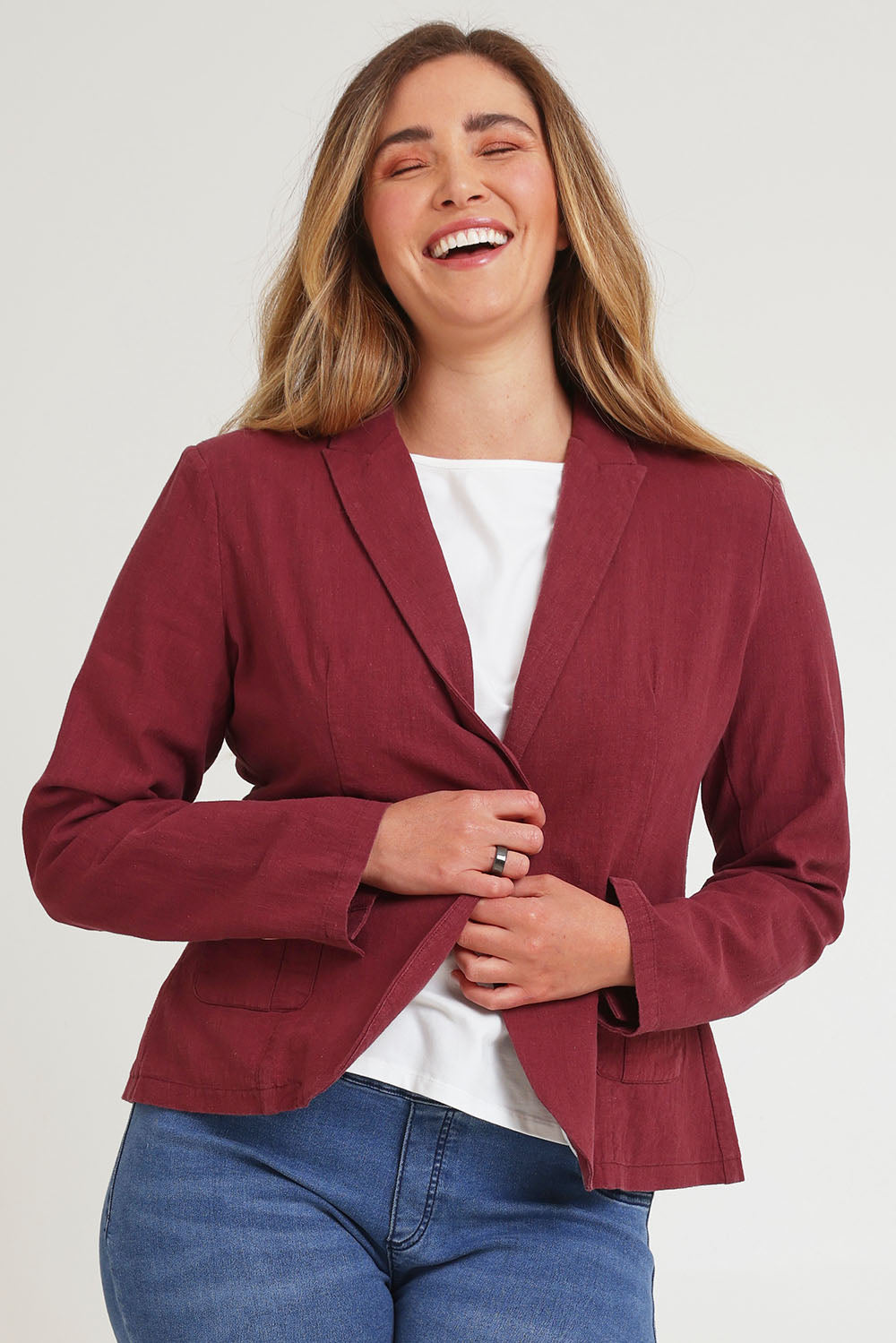 Model Chanel wearing size 16 of the Cotton Linen Blazer in colour Wine (Red), from the front, cropped image