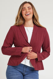 Model Chanel wearing size 16 of the Cotton Linen Blazer in colour Wine (Red), from the front, cropped image