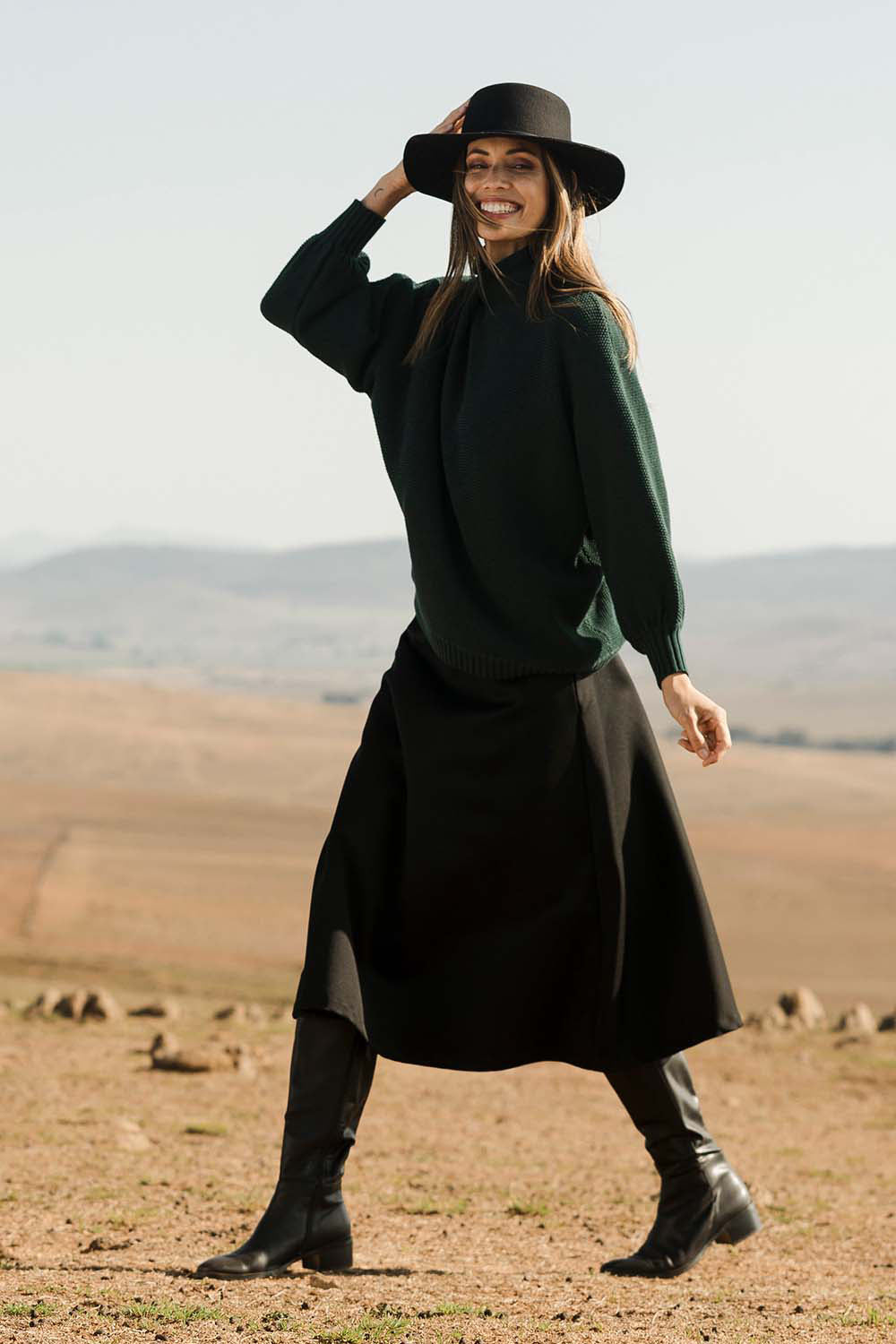 Model Amanda wearing size 10 of the Wool Ain colourline Skirt - Midnight (Black), from the front, showing the whole outfit