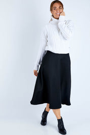 Model Laura wearing size 14 of the Wool Ain colourline Skirt - Midnight (Black), from the front, showing the whole outfit