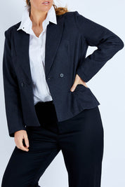 Model Laura wearing size 14 of the Classic Wool Blazer in colour Fossil (Black), from the front, cropped image