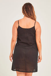Model Laura wearing size 14 of the Cotton Slip in colour Black (Black), from the back