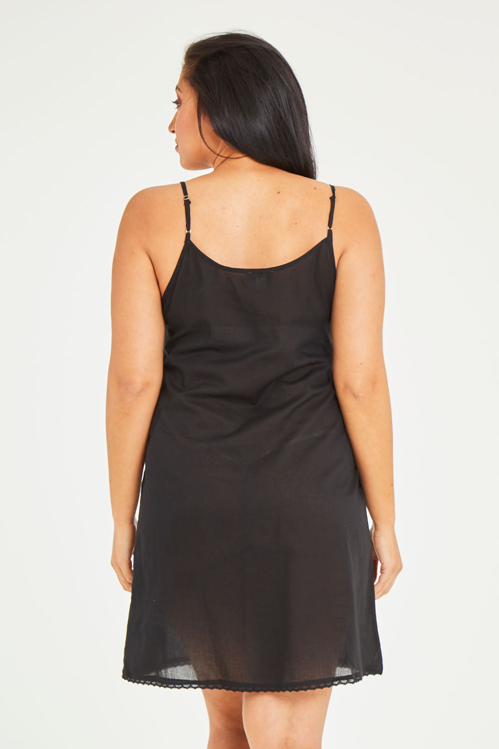 Model Terri-Leigh wearing size 14 of the Cotton Slip in colour Black (Black), from the back