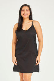 Model Terri-Leigh wearing size 14 of the Cotton Slip in colour Black (Black), from the front, cropped image