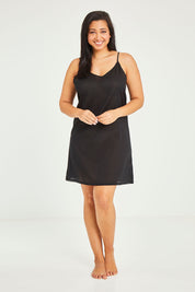 Model Terri-Leigh wearing size 14 of the Cotton Slip in colour Black (Black), from the front, showing the whole outfit