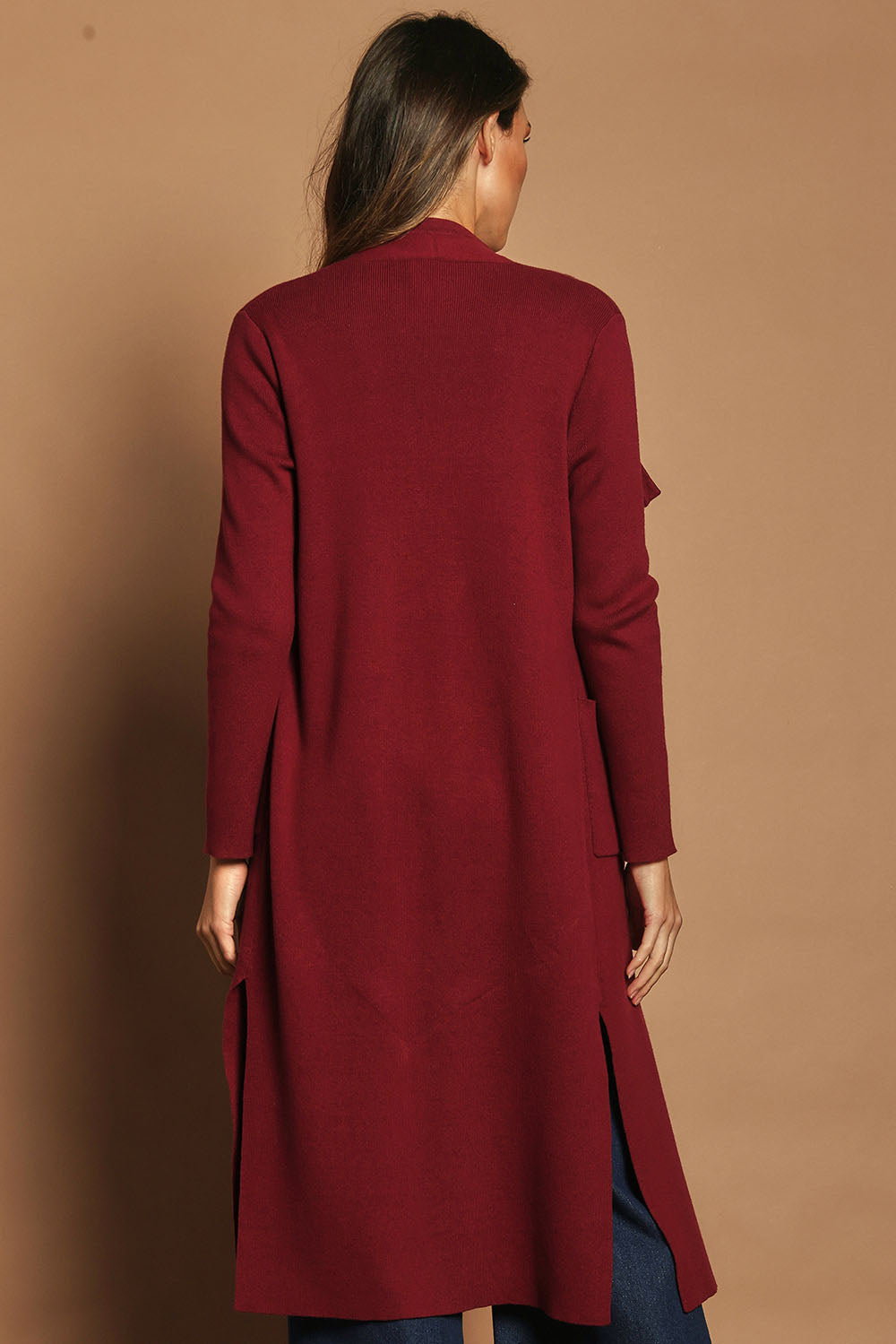 Model Madeline wearing size S of the Cotton Cashmere Waterfall Cardigan in colour Berry (Red), from the back