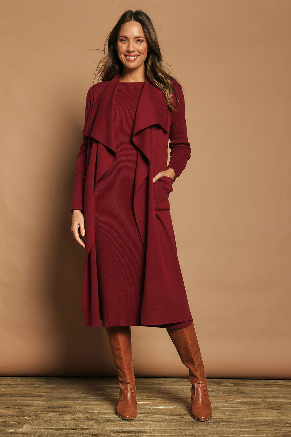 Model Madeline wearing size S of the Cotton Cashmere Waterfall Cardigan in colour Berry (Red), from the front, showing the whole outfit