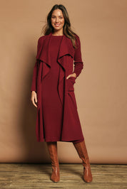 Model Madeline wearing size S of the Cotton Cashmere Waterfall Cardigan in colour Berry (Red), from the front, showing the whole outfit