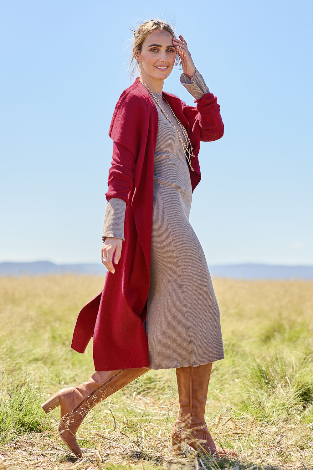 Model Tegan wearing size S of the Cotton Cashmere Waterfall Cardigan in colour Berry (Red), from the front, showing the whole outfit