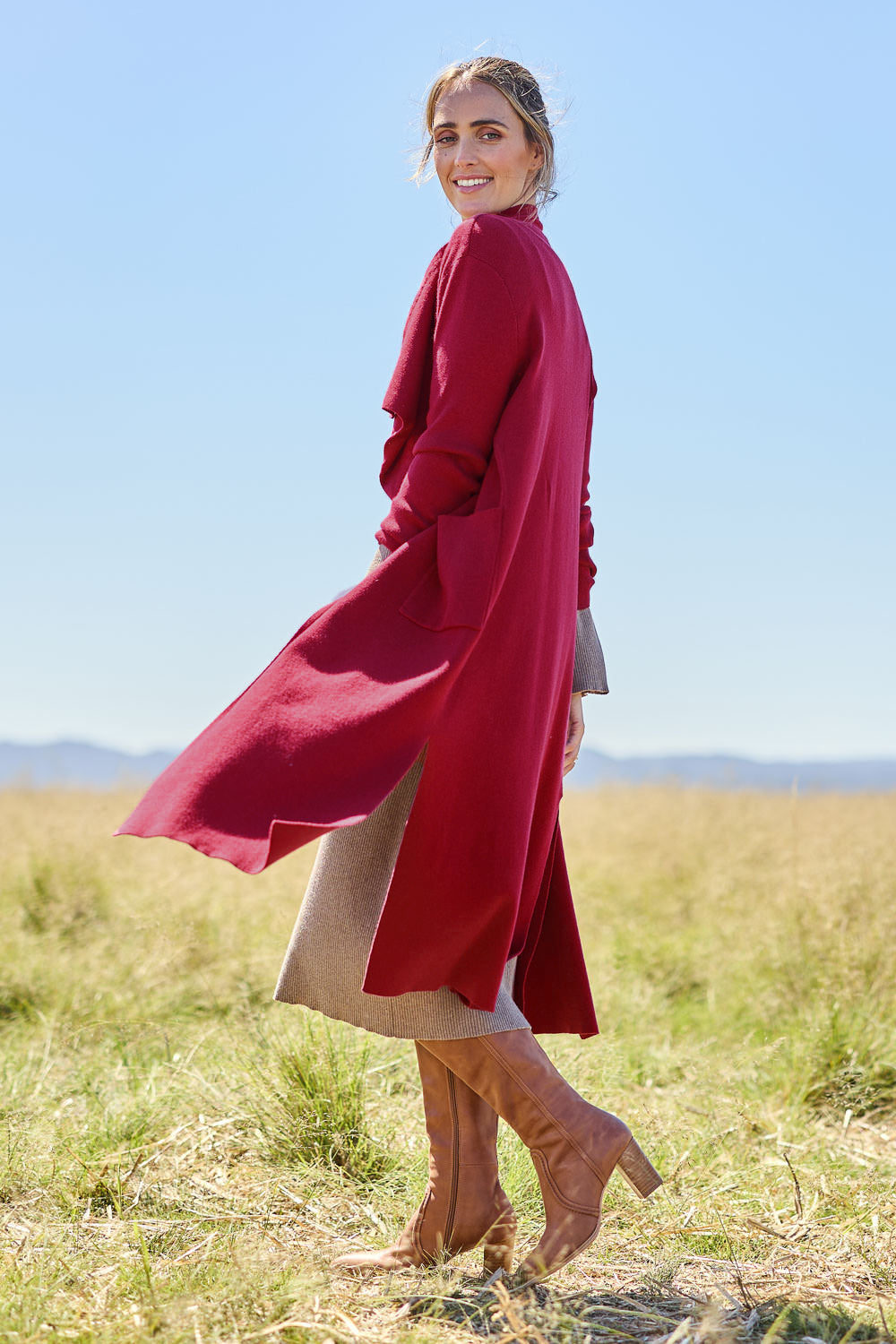 Model Tegan wearing size S of the Cotton Cashmere Waterfall Cardigan in colour Berry (Red), from the front, showing the whole outfit