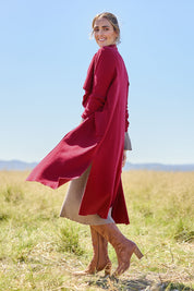 Model Tegan wearing size S of the Cotton Cashmere Waterfall Cardigan in colour Berry (Red), from the front, showing the whole outfit