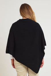 Model Chanel wearing size XL of the Cotton Cashmere Wool Poncho in colour Black (Black), from the back