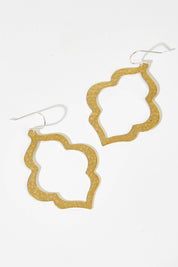 A model wearing size OneSize of the Ali Raw Brass Drop Earring in colour Rawbrass (Metallics), from the front, showing the whole outfit