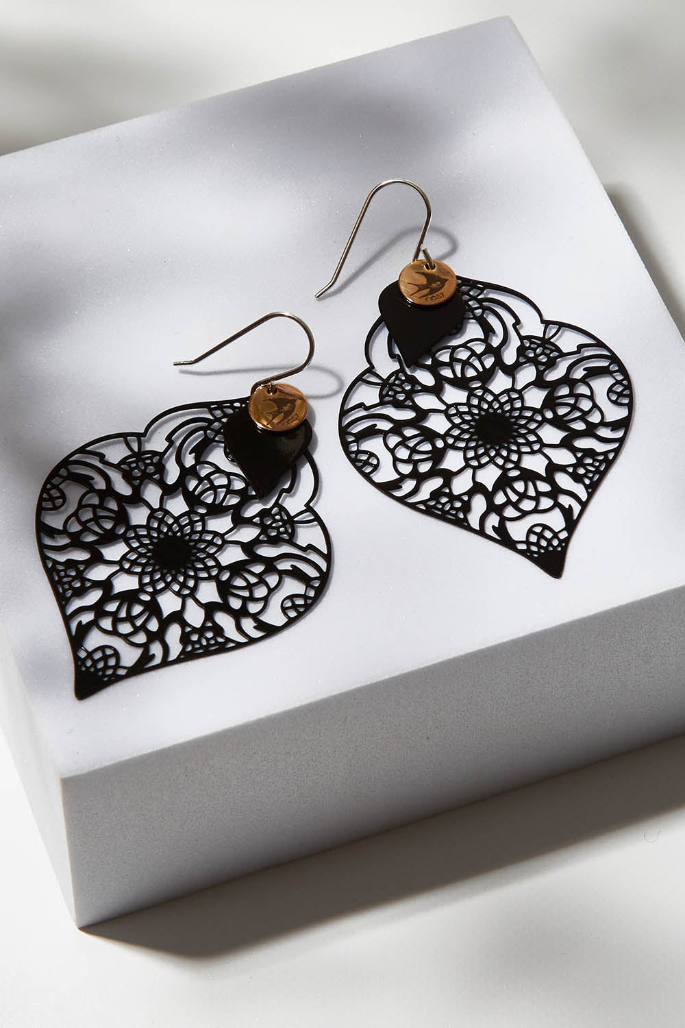 A model wearing size OneSize of the Black On Black Filigree Earring in colour Black (Black), from the front, showing the whole outfit