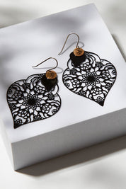 A model wearing size OneSize of the Black On Black Filigree Earring in colour Black (Black), from the front, showing the whole outfit