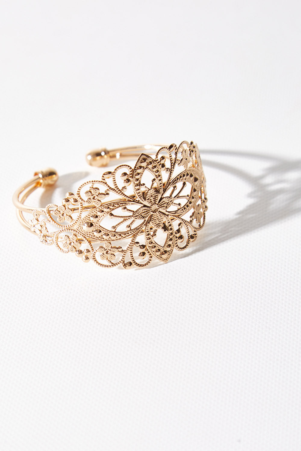 A model wearing size OneSize of the Earthly Delights Bangle in colour Rosegold (Metallics), from the front, showing the whole outfit