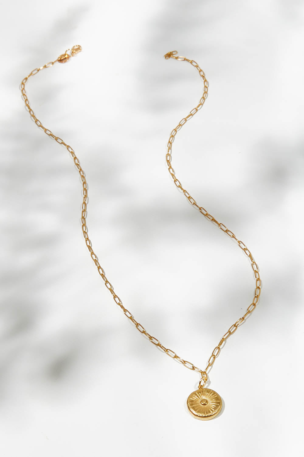A model wearing size OneSize of the Earth Drop Pendant Necklace in colour Gold (Metallics), from the front, showing the whole outfit
