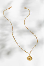 A model wearing size OneSize of the Earth Drop Pendant Necklace in colour Gold (Metallics), from the front, showing the whole outfit