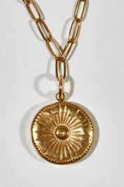 A model wearing size OneSize of the Earth Drop Pendant Necklace in colour Gold (Metallics), from the front, showing the whole outfit