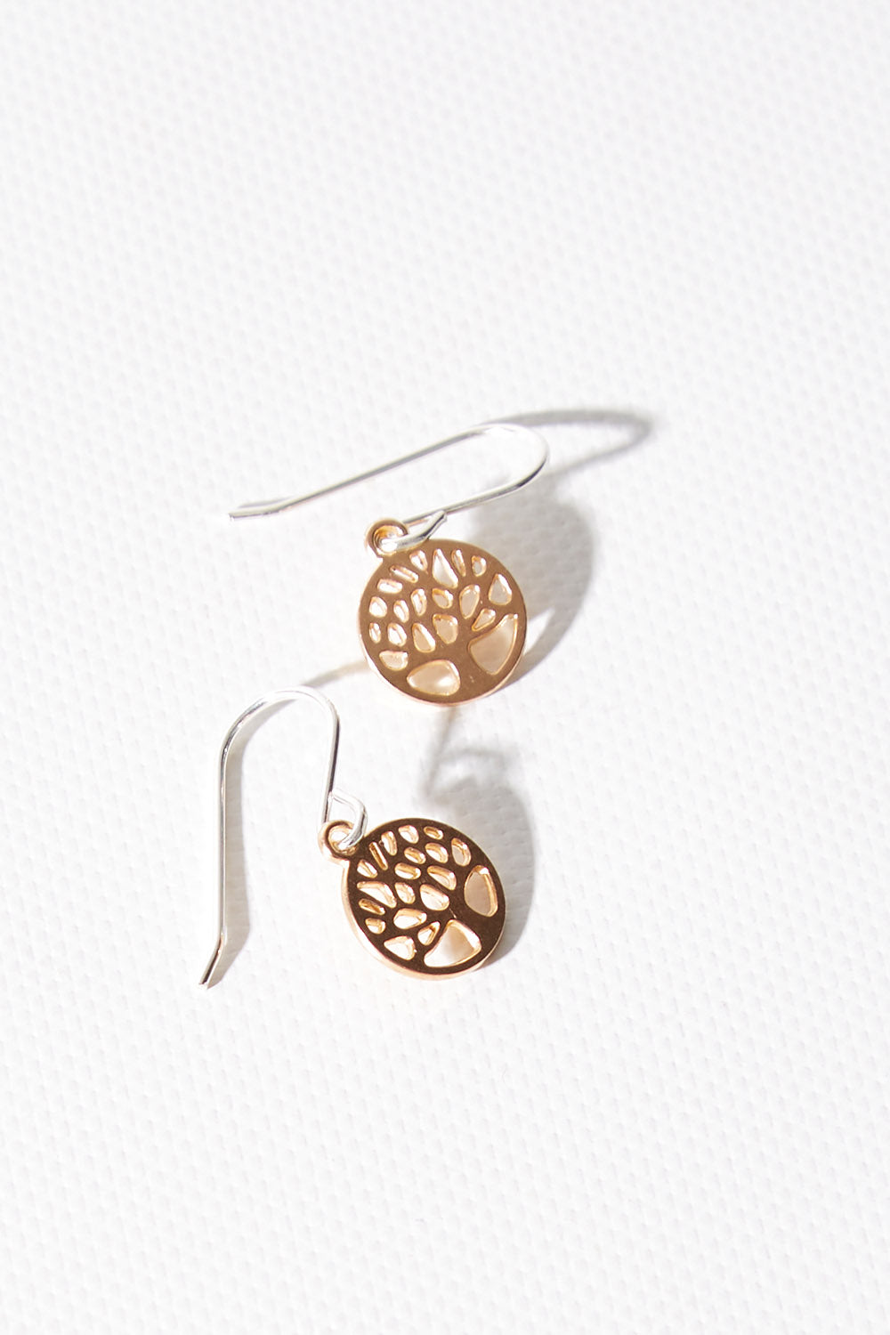 A model wearing size OneSize of the Rose Gold Elm Earring in colour Rosegold (Metallics), from the front, showing the whole outfit