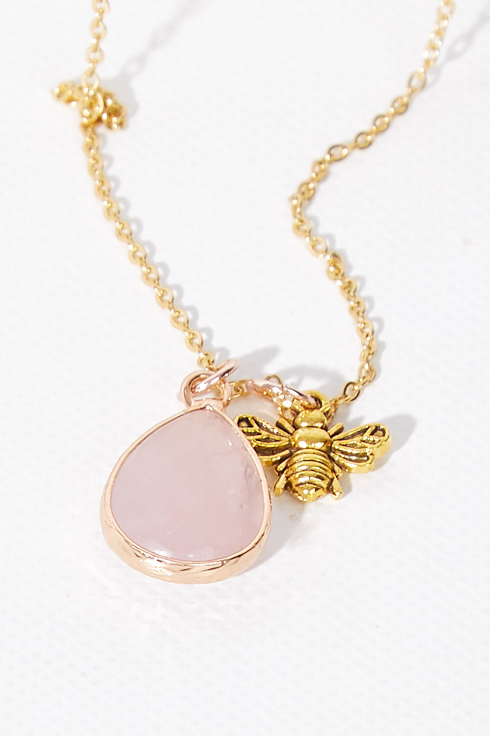 A model wearing size OneSize of the Love Rose Quartz Drop Necklace in colour Rose (Metallics), from the front, showing the whole outfit