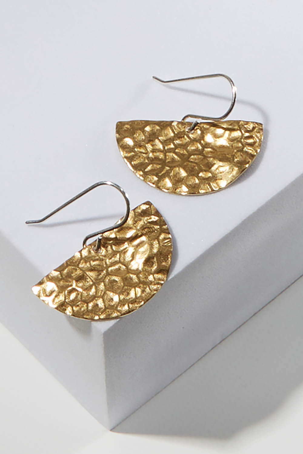 A model wearing size OneSize of the Nova Raw Brass Earring in colour Rawbrass (Metallics), from the front, showing the whole outfit