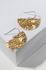 A model wearing size OneSize of the Nova Raw Brass Earring in colour Rawbrass (Metallics), from the front, showing the whole outfit