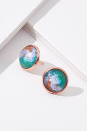 A model wearing size OneSize of the Sapphire Coast Stud Earrings in colour Metallic (Metallics), from the front, showing the whole outfit