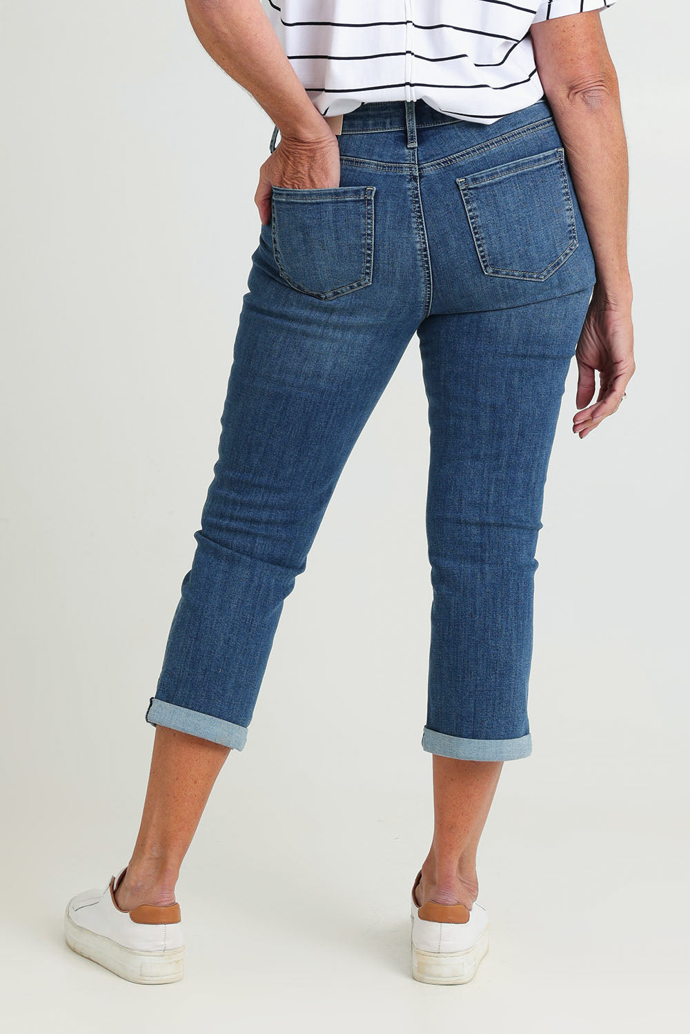 Model Sandy wearing the Chloe Capri Jean in colour Costabrava (Blue), from the back