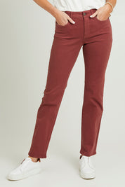 Model Grace wearing the Marilyn Straight Jean in colour Emotion (Red), from the front, cropped image