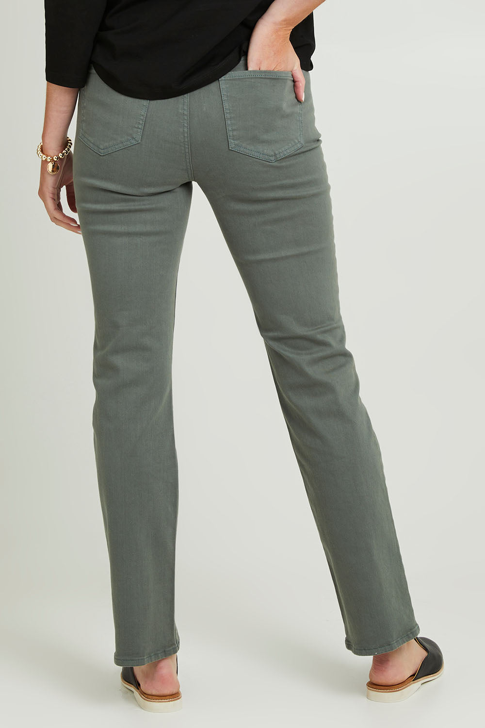 Model Grace wearing the Marilyn Straight Jean in colour Sageleaf (Green), from the back