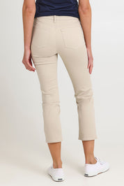 Model Madeline wearing the Sheri Slim Ankle Jean in colour Feather, from the back