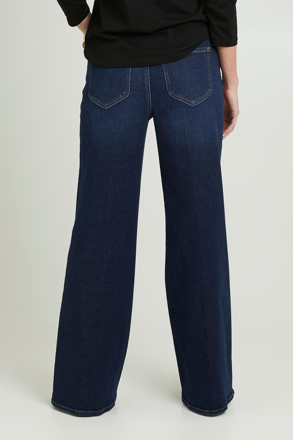 Model Grace wearing the Mia Palazzo Pant in colour Northbridg (Blue), from the back