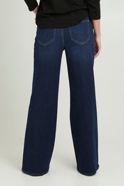 Model Grace wearing the Mia Palazzo Pant in colour Northbridg (Blue), from the back