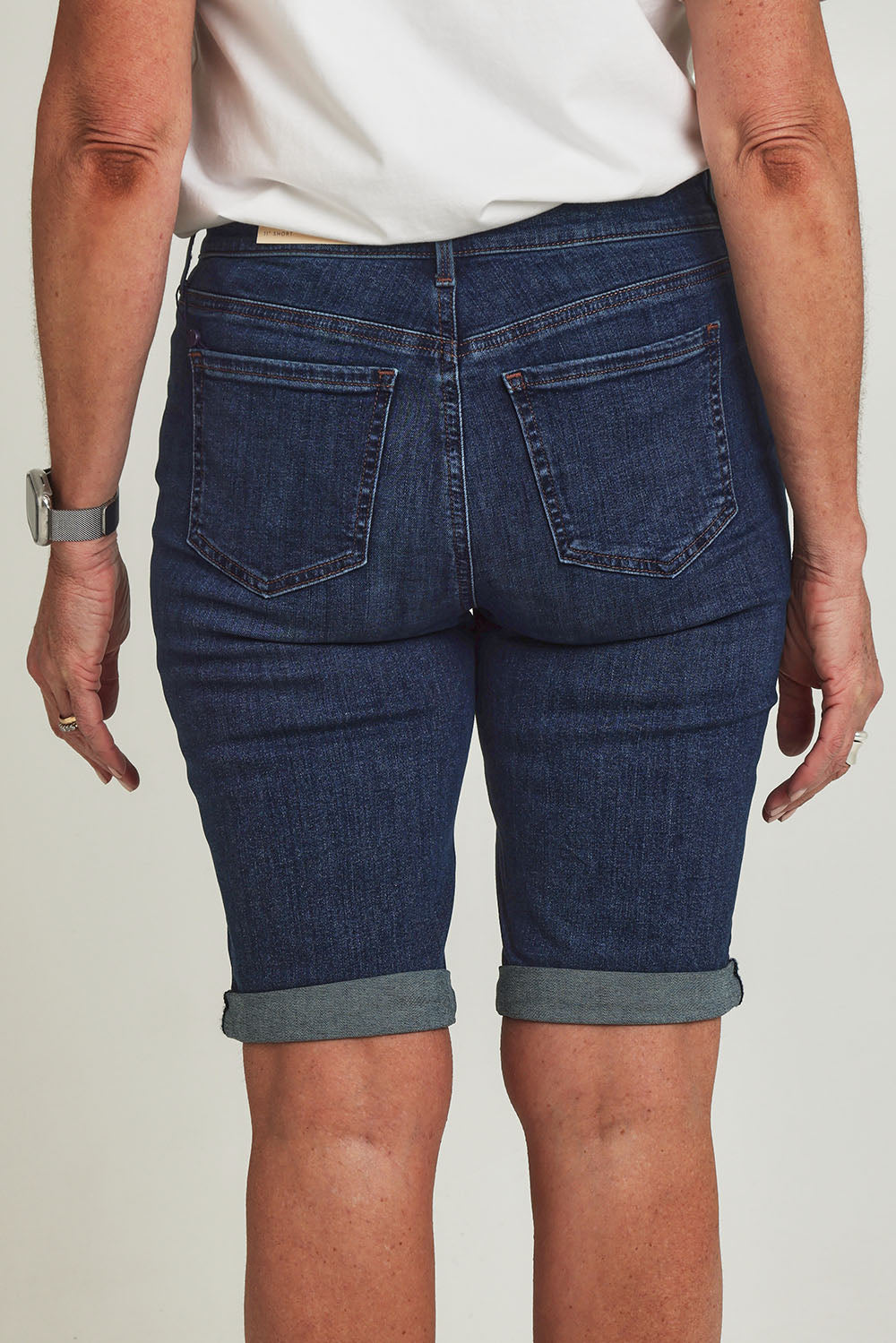 Model Sandy wearing the Briella Short in colour Goldcoast (Blue), from the back