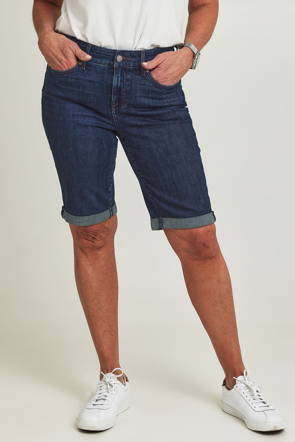 Model Sandy wearing the Briella Short in colour Goldcoast (Blue), from the front, cropped image