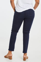Model Noli wearing the Sheri Slim Jean in colour Rinse (Blue), from the back
