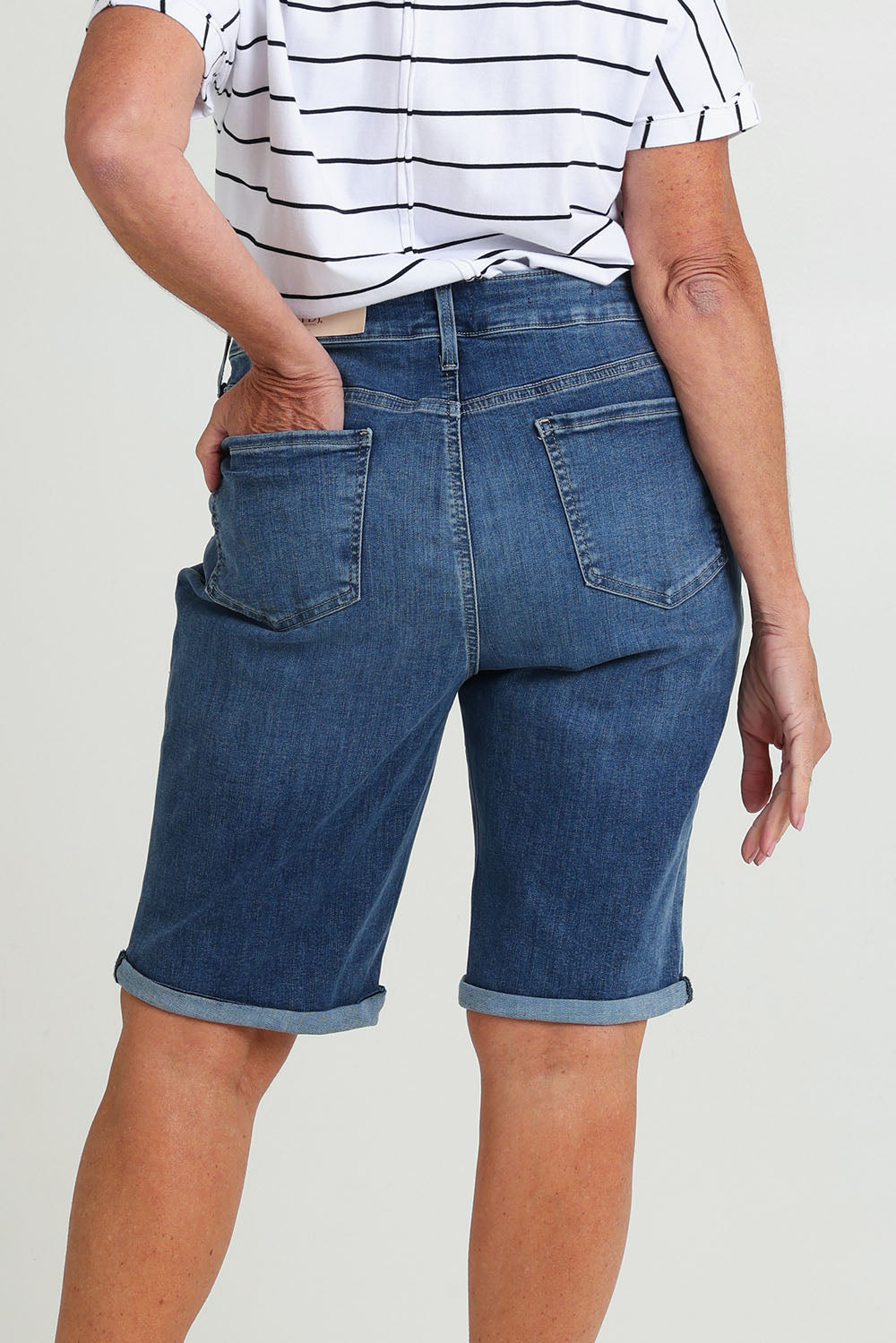 Model Sandy wearing the Briella Short in colour Valencia (Blue), from the back