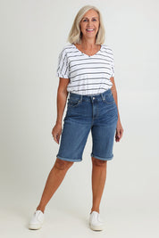 Model Sandy wearing the Briella Short in colour Valencia (Blue), from the front, showing the whole outfit
