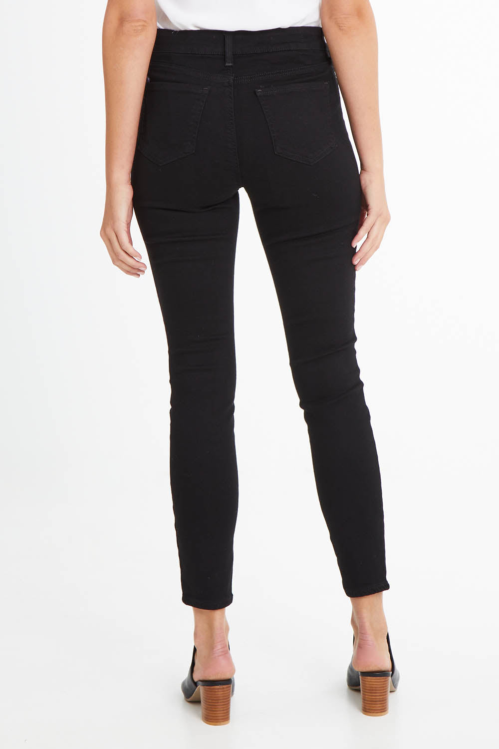 Model Madeline wearing the Ami Skinny Jean in colour Black (Black), from the back