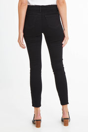 Model Madeline wearing the Ami Skinny Jean in colour Black (Black), from the back
