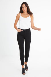 Model Madeline wearing the Ami Skinny Jean in colour Black (Black), from the front, showing the whole outfit