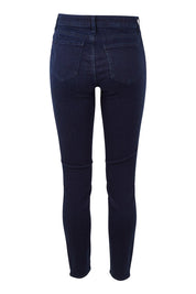 Product shot of the Ami Skinny Jean in colour Rinse (Blue), from the back
