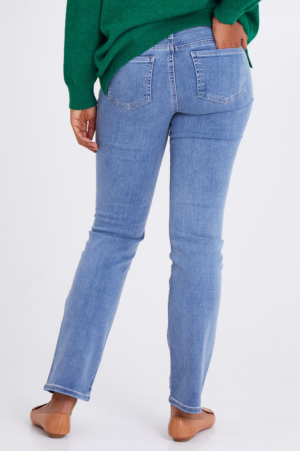 Model Olivia wearing the Marilyn Straight Jean in colour Haley (Blue), from the back