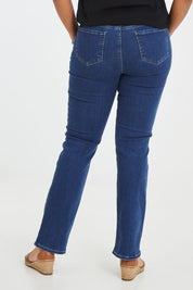 Model Noli wearing the Marilyn Straight Jean in colour Quinn (Blue), from the back