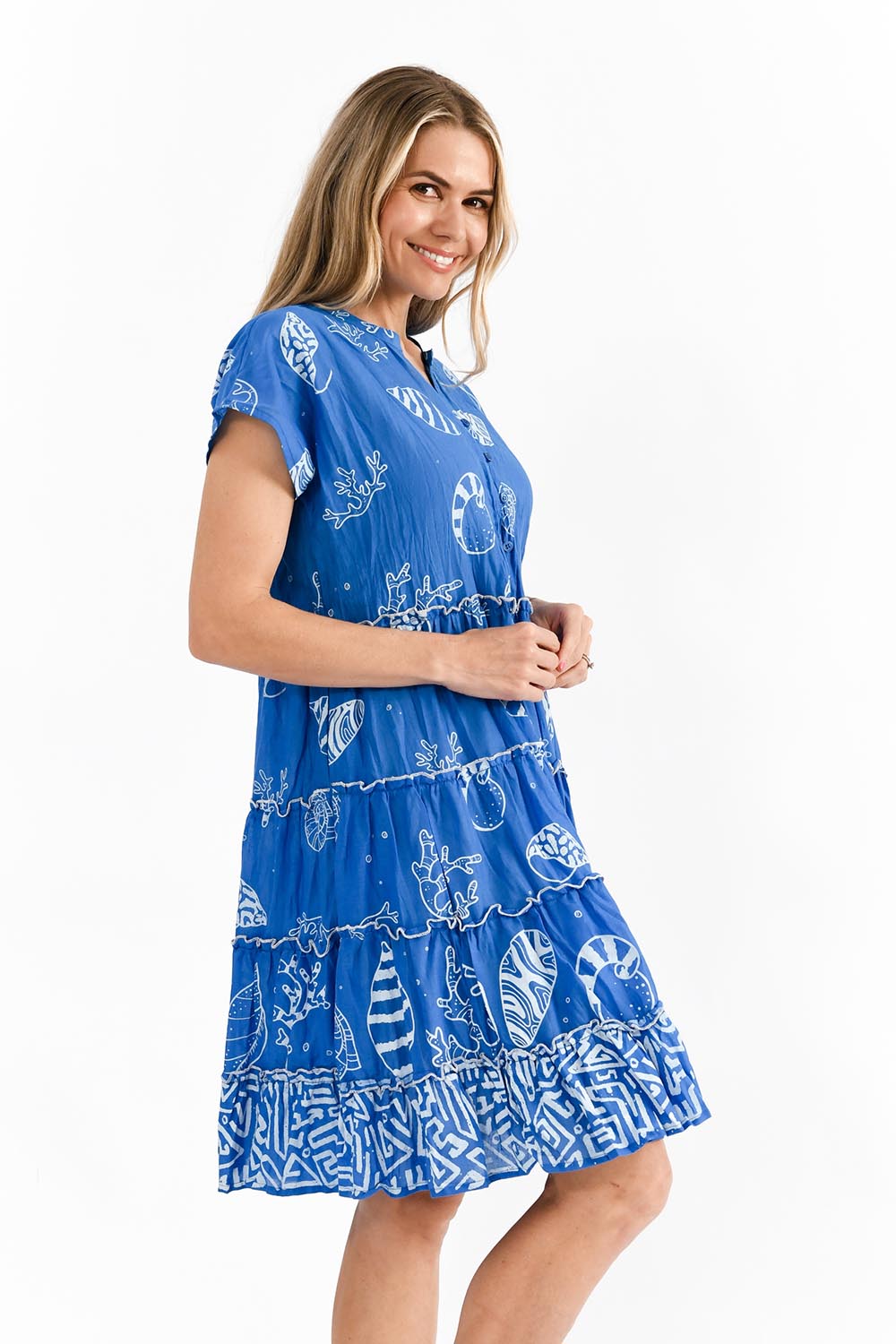A model wearing the Tiered Cotton Dress in colour Cobalt (Blue), from the front, cropped image