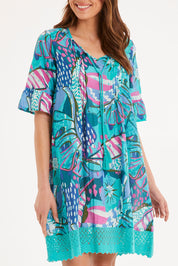Model Madeline wearing size 10 of the Hannah Short Sleeve Boho Dress in colour Print1 (Blue), from the front, cropped image