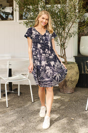 Model Genericm wearing size sample of the Nicola Cotton Dress - Navy in colour Navy, from the front